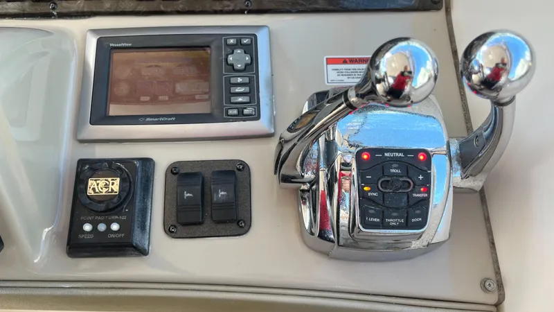 Lowest Price In Usa ! Yacht Photos Pics Control panel of a 2008 Sea Ray 380 Sundancer boat with navigation and throttle controls.