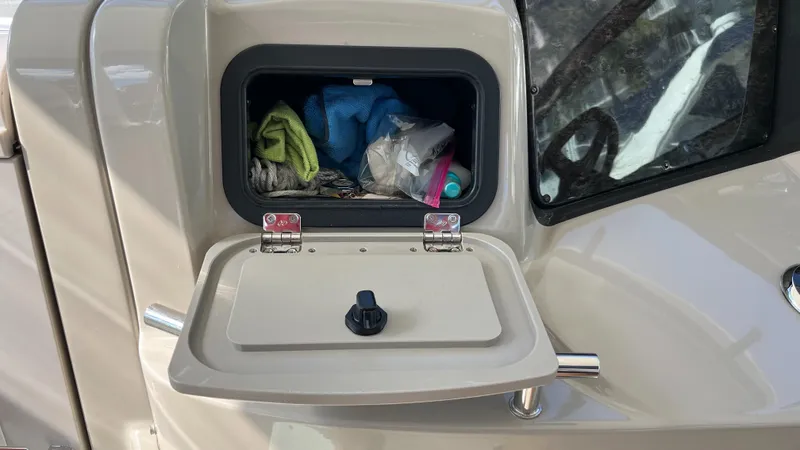 Lowest Price In Usa ! Yacht Photos Pics Storage compartment on a 2008 Sea Ray 380 Sundancer boat, containing various items.