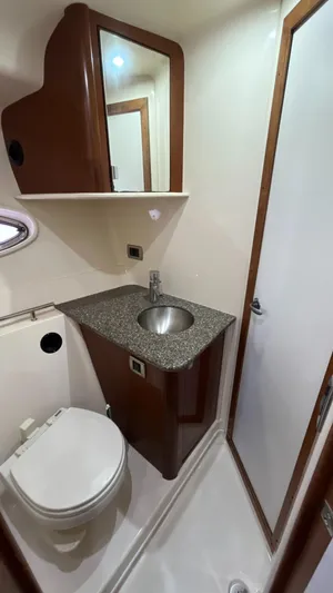 Lowest Price In Usa ! Yacht Photos Pics 2008 Sea Ray 380 Sundancer bathroom with sink, toilet, and mirror.