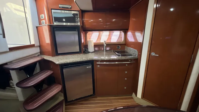 Lowest Price In Usa ! Yacht Photos Pics 2008 Sea Ray 380 Sundancer yacht kitchen with modern appliances and wood finish.