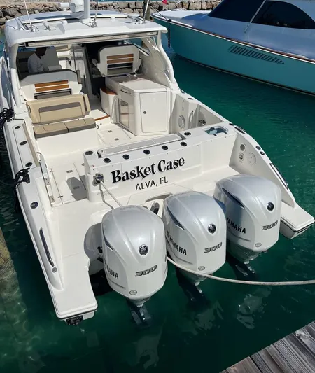  Yacht Photos Pics 2020 Pursuit DC 365 Dual Console boat with triple Yamaha engines docked in clear water.