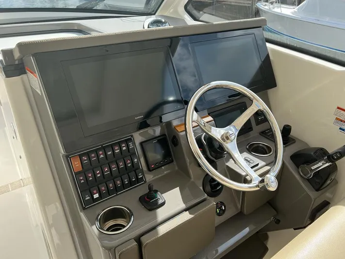  Yacht Photos Pics 2020 Pursuit DC 365 Dual Console helm with dual screens and steering wheel.