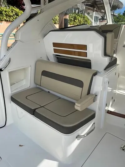  Yacht Photos Pics 2020 Pursuit DC 365 Dual Console interior seating with beige and gray upholstery.