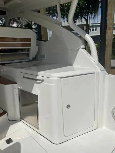  Yacht Photos Pics 2020 Pursuit DC 365 Dual Console interior with sleek cabinetry and modern design.