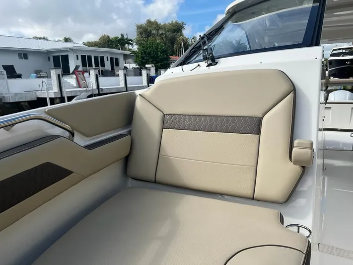  Yacht Photos Pics 2020 Pursuit DC 365 Dual Console boat interior with beige seating.