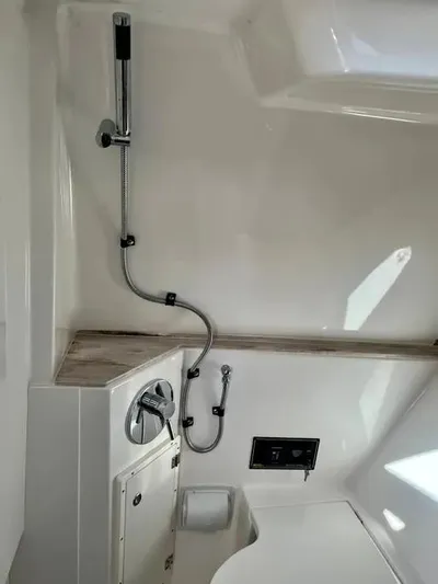  Yacht Photos Pics 2020 Pursuit DC 365 Dual Console interior shower area with modern fixtures.