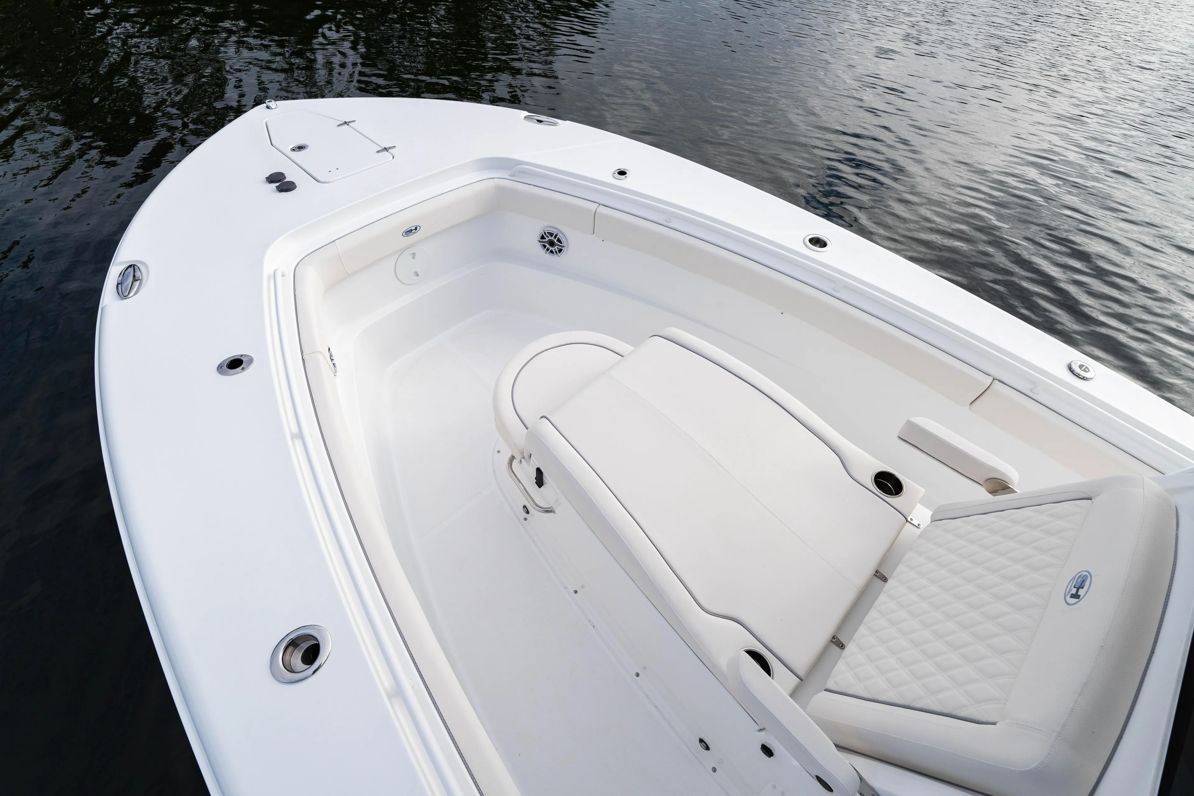  Yacht Photos Pics 2026 Sea Hunt Ultra 285 Coffin Box boat interior with cushioned seating and water view.