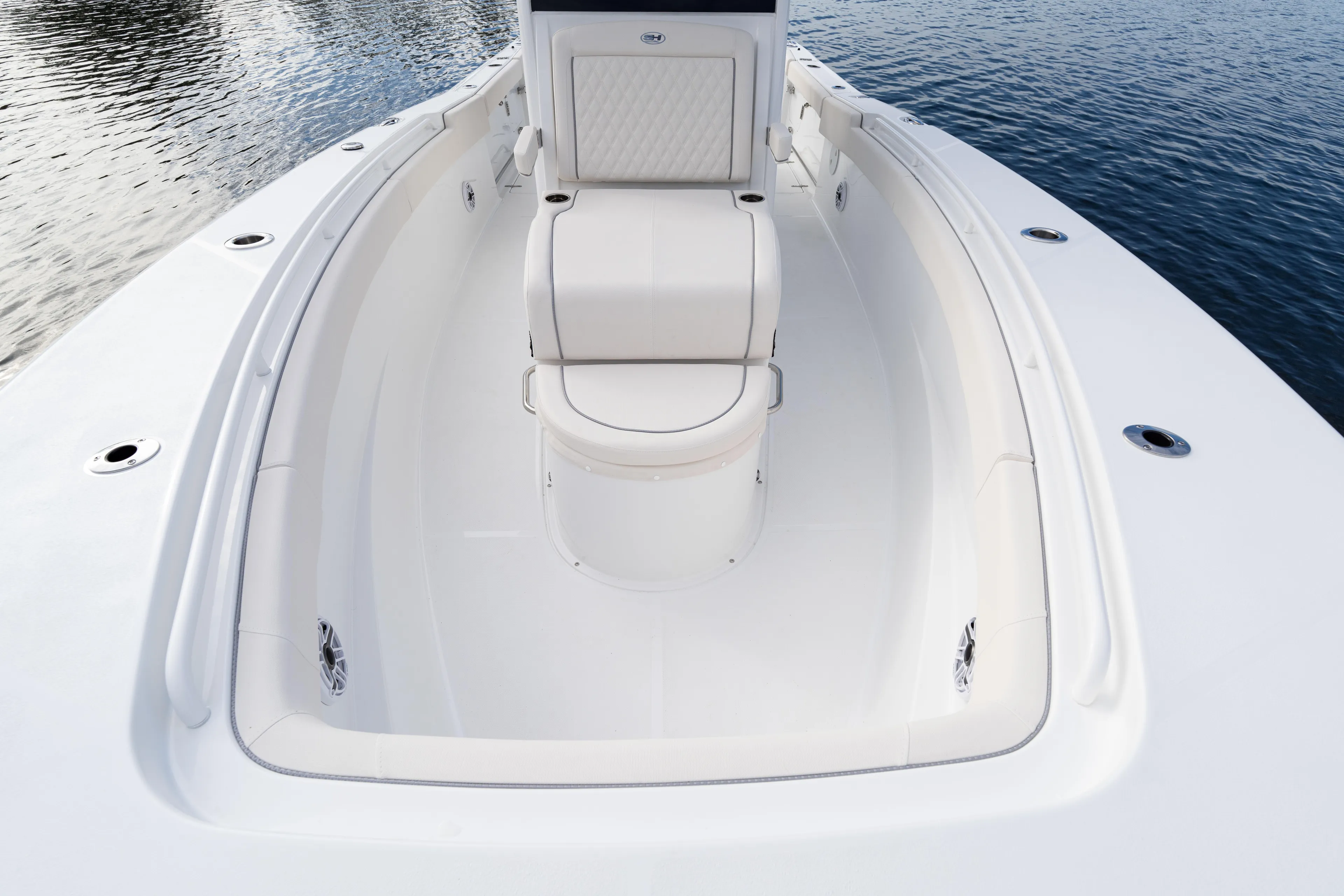  Yacht Photos Pics 2026 Sea Hunt Ultra 285 Coffin Box boat interior with seating, on calm water.