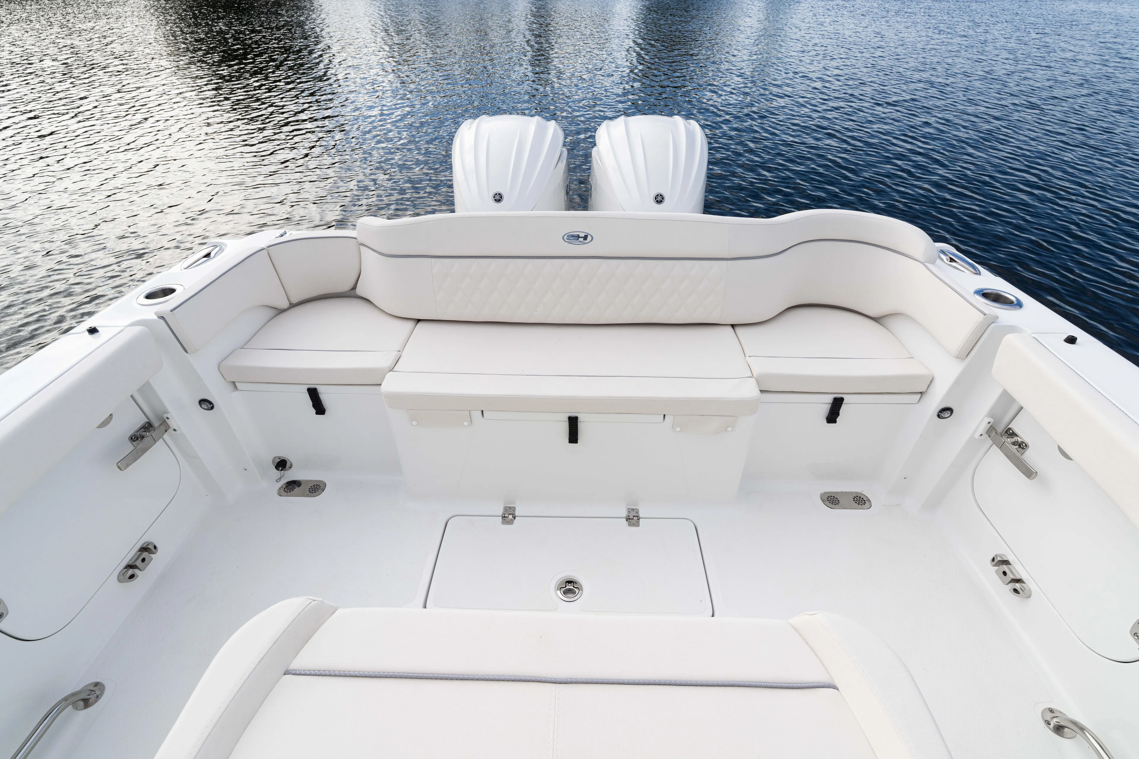  Yacht Photos Pics 2026 Sea Hunt Ultra 285 Coffin Box boat interior with white seating and twin engines.