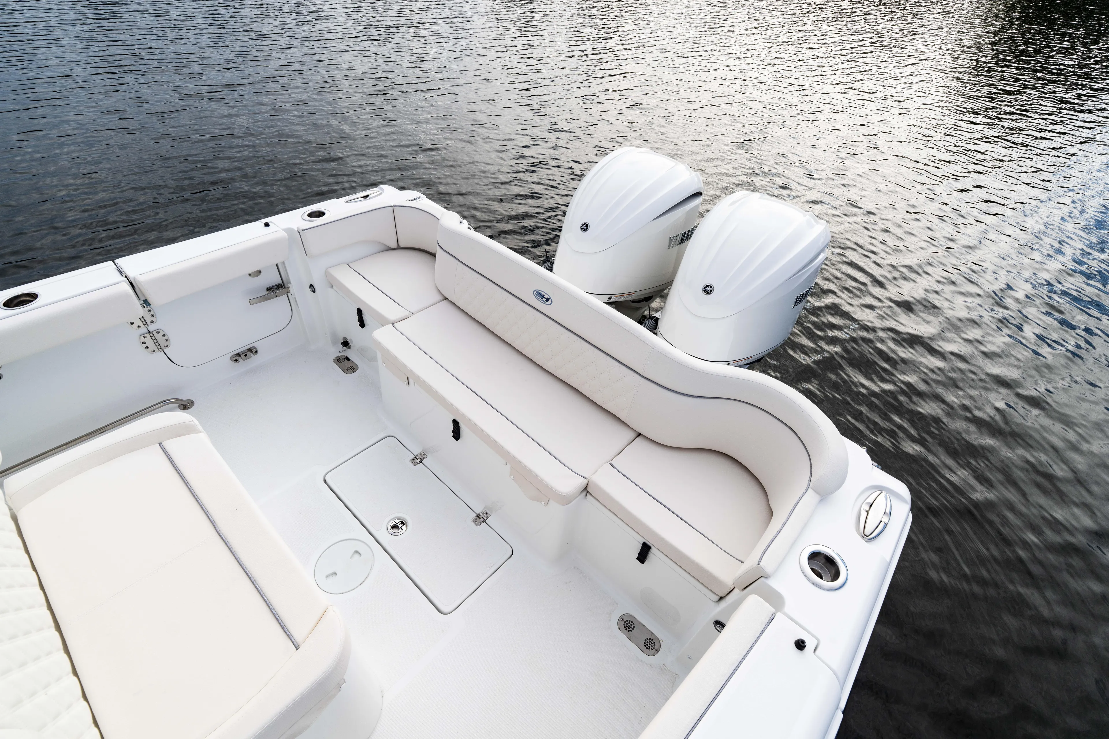  Yacht Photos Pics 2026 Sea Hunt Ultra 285 Coffin Box boat interior with dual engines on water.