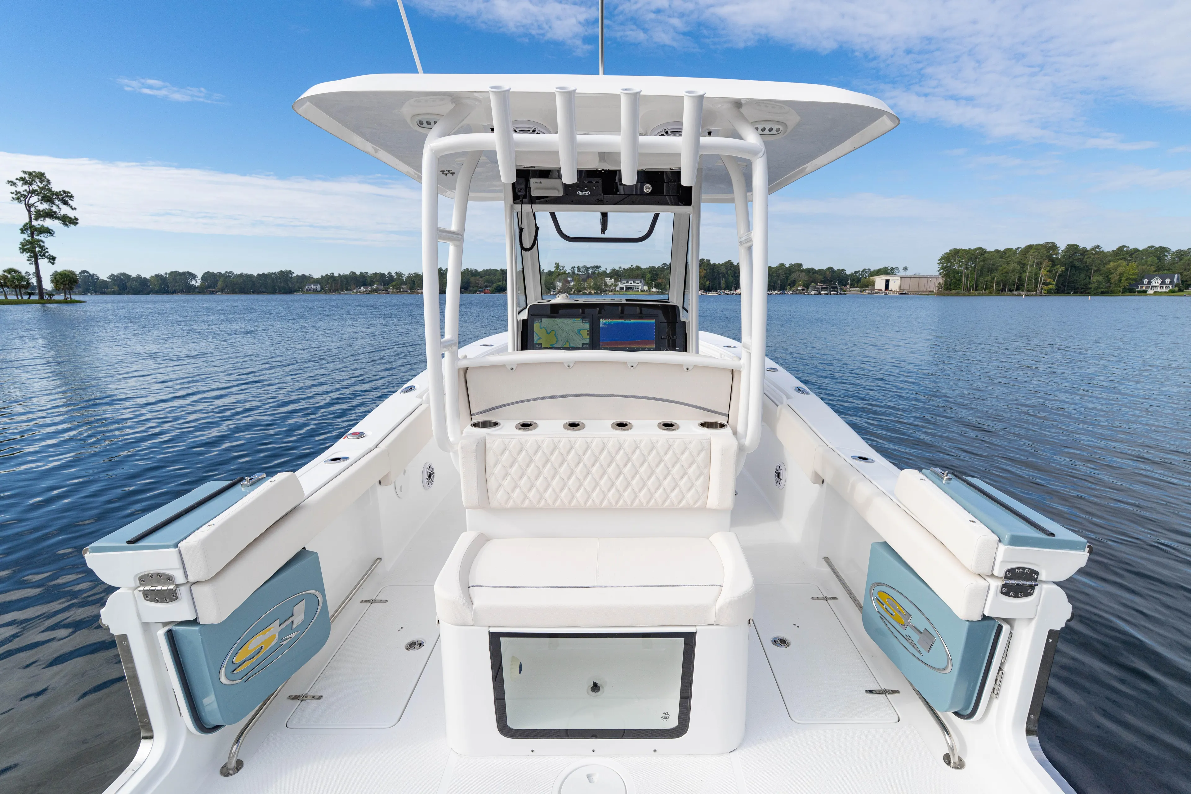  Yacht Photos Pics 2026 Sea Hunt Ultra 285 Coffin Box boat on a serene lake.