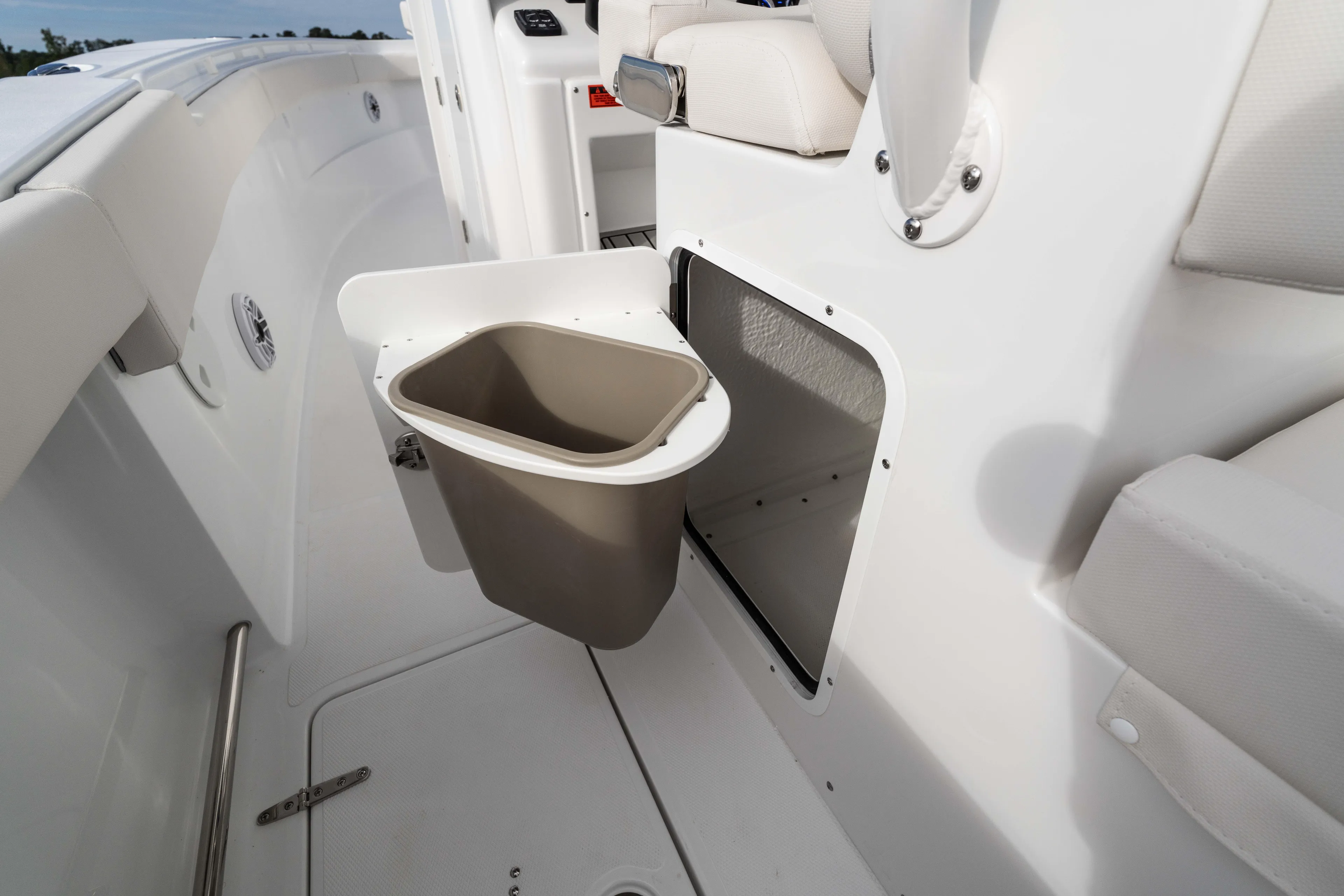  Yacht Photos Pics 2026 Sea Hunt Ultra 285 Coffin Box boat interior with storage compartment and trash bin.