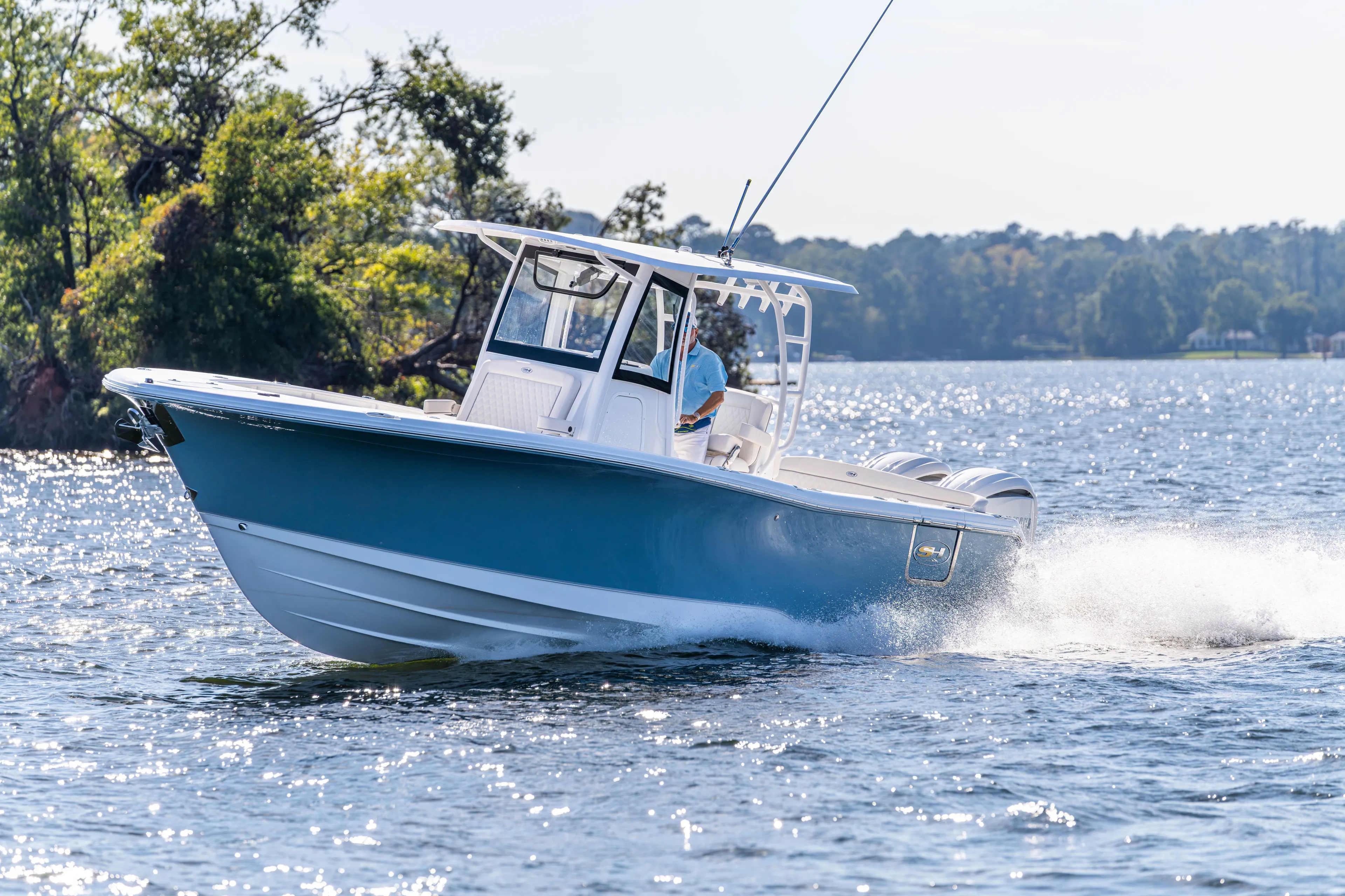  Yacht Photos Pics 2026 Sea Hunt Ultra 285 Coffin Box cruising on a sunny lake.