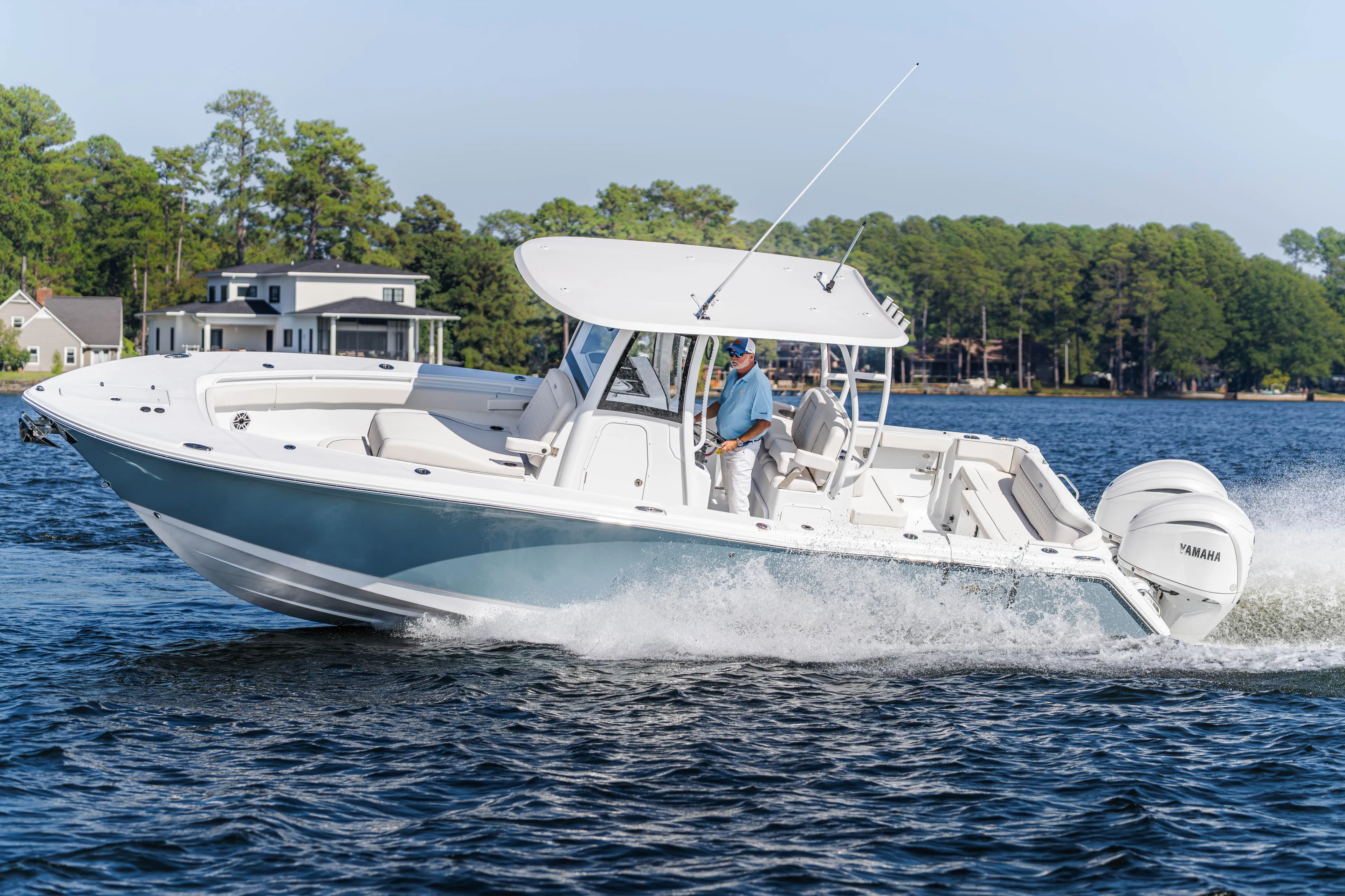  Yacht Photos Pics 2026 Sea Hunt Ultra 285 Coffin Box cruising on a scenic lake.