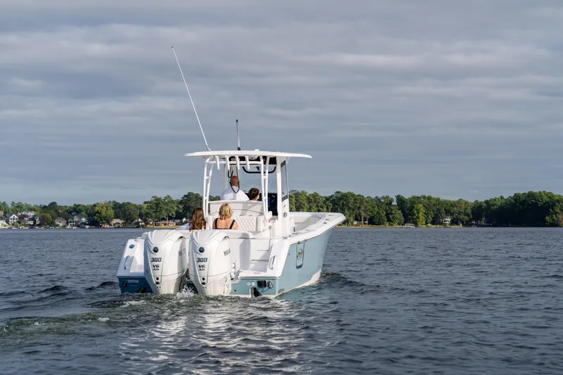  Yacht Photos Pics 2026 Sea Hunt Ultra 285 Coffin Box boat cruising on a lake with passengers.