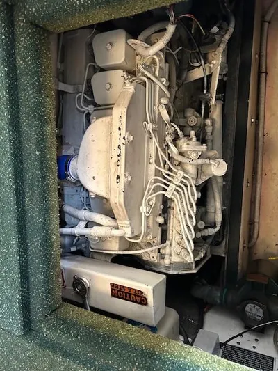 Forget Me Knot Yacht Photos Pics Engine compartment of a 2001 Nordic Tug 32, showcasing intricate mechanical components.