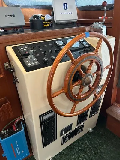 Forget Me Knot Yacht Photos Pics Steering wheel and control panel of a 2001 Nordic Tug 32 boat.