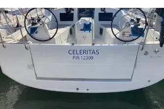 Celeritas Yacht Photos Pics Jeanneau Sun Odyssey 410 sailboat, 2019 model, named Celeritas, docked with dual steering wheels.