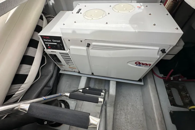 Seas The Day Yacht Photos Pics Onan marine generator in a 2004 Meridian 580 Pilothouse engine room.