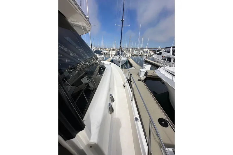 Seas The Day Yacht Photos Pics 2004 Meridian 580 Pilothouse yacht docked at marina, showcasing sleek design and spacious deck.