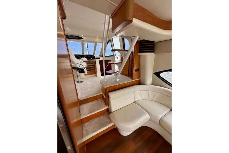Seas The Day Yacht Photos Pics Luxurious interior of 2004 Meridian 580 Pilothouse yacht with elegant seating and helm station.