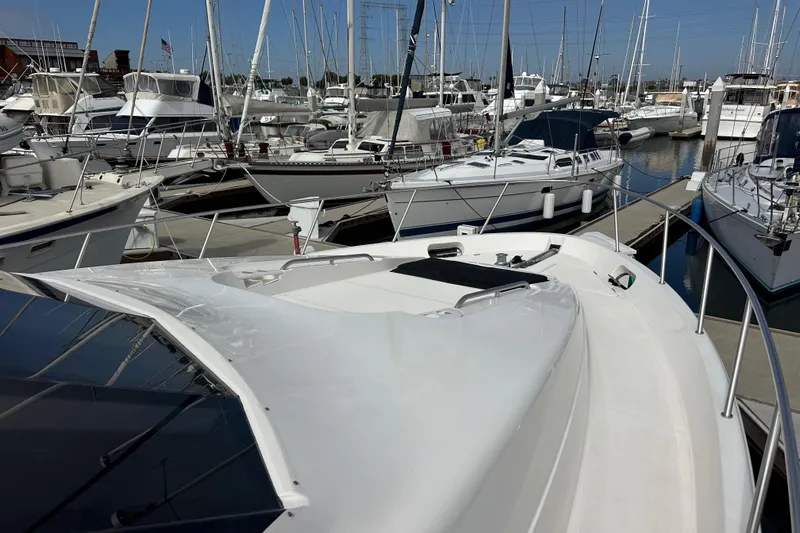 Seas The Day Yacht Photos Pics 2004 Meridian 580 Pilothouse yacht docked in a marina with other boats.