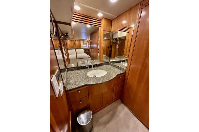 Seas The Day Yacht Photos Pics Luxurious bathroom in 2004 Meridian 580 Pilothouse yacht with wood cabinetry and granite countertop.