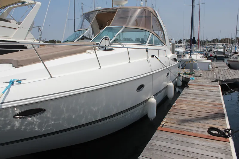 My Jojo Yacht Photos Pics 2005 Cruisers Yachts 370 Express docked at marina, side view.
