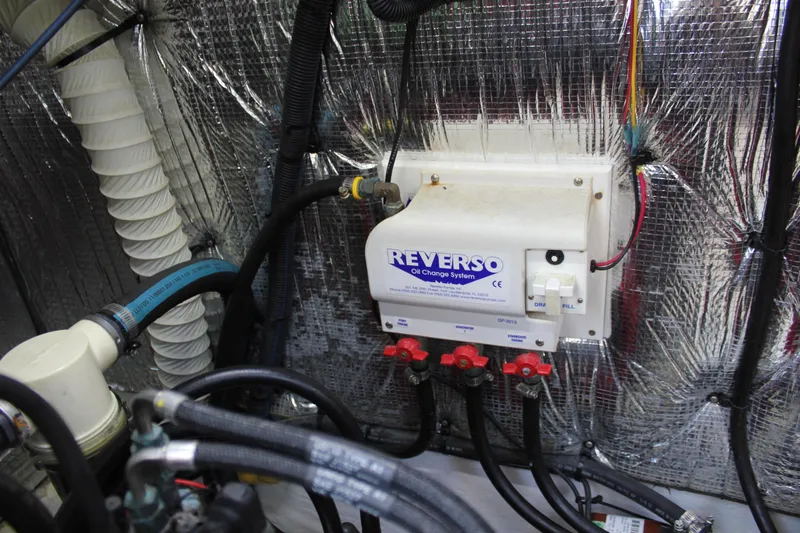 My Jojo Yacht Photos Pics Engine room of 2005 Cruisers Yachts 370 Express with Reverso oil change system.