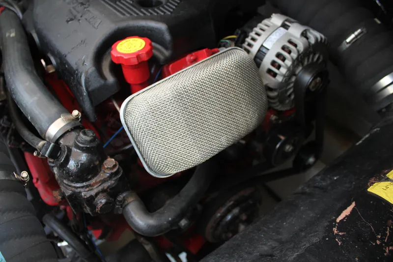 My Jojo Yacht Photos Pics Engine components of a 2005 Cruisers Yachts 370 Express, featuring alternator and hoses.