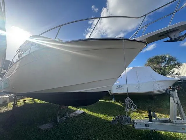  Yacht Photos Pics 2021 Grady-White Express 370 boat on trailer under sunny sky.