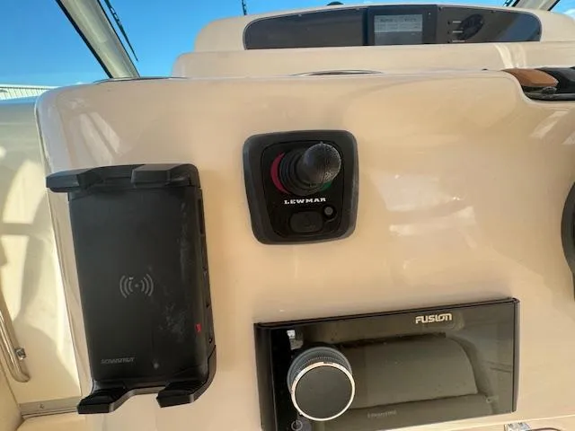  Yacht Photos Pics Grady-White Express 370 helm controls, featuring Lewmar joystick and Fusion audio system, 2021 model.