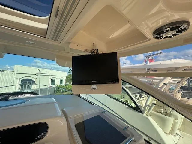  Yacht Photos Pics 2021 Grady-White Express 370 interior with mounted TV and speaker system.