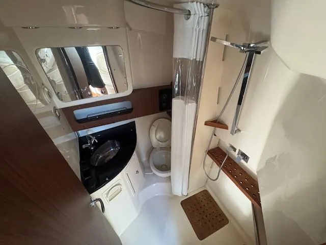  Yacht Photos Pics 2021 Grady-White Express 370 bathroom with shower, sink, and toilet.