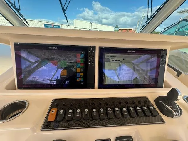  Yacht Photos Pics 2021 Grady-White Express 370 helm with dual Simrad displays and control panel.