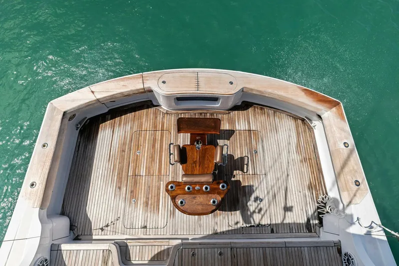 Big Game Yacht Photos Pics 2006 Hatteras 68 Convertible yacht deck with wooden finish and fishing chair.