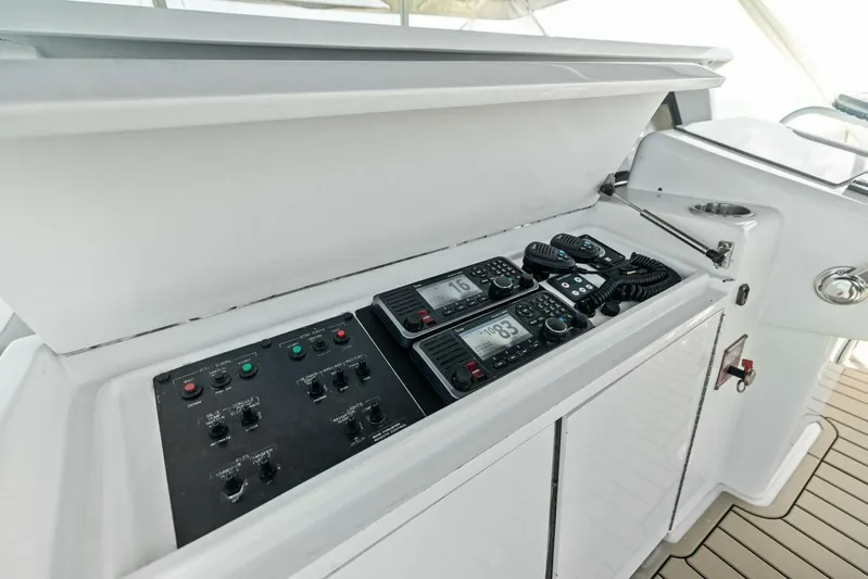Big Game Yacht Photos Pics Control panel and radios on 2006 Hatteras 68 Convertible yacht.