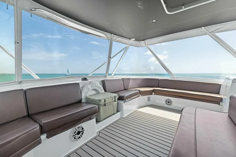 Big Game Yacht Photos Pics Luxurious interior of 2006 Hatteras 68 Convertible yacht with ocean view.