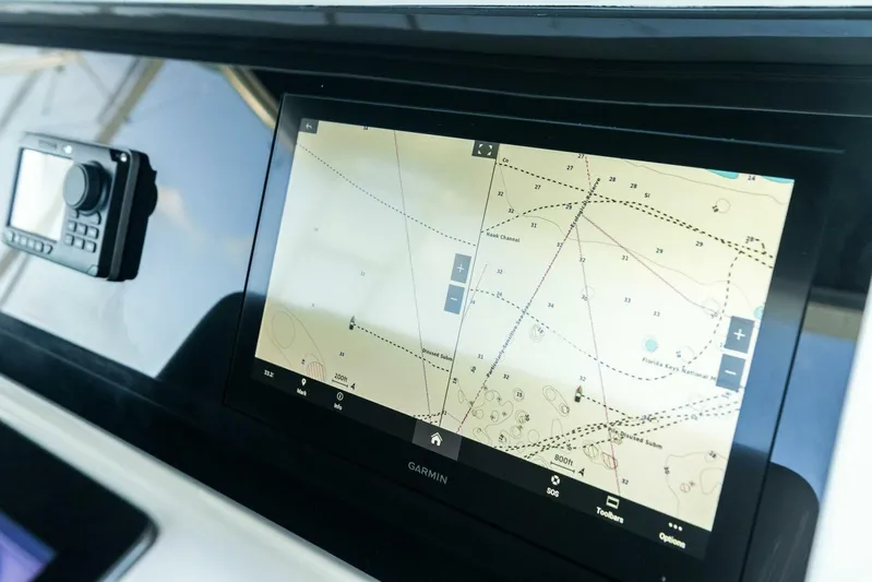 Big Game Yacht Photos Pics Navigation system on 2006 Hatteras 68 Convertible yacht, displaying marine chart.