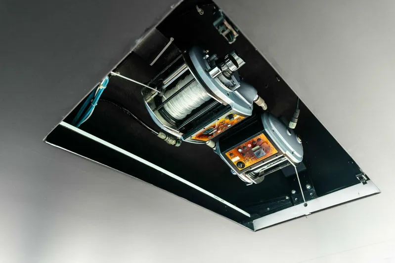 Big Game Yacht Photos Pics Ceiling-mounted fishing reels on a 2006 Hatteras 68 Convertible yacht.