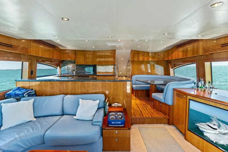 Big Game Yacht Photos Pics Luxurious interior of 2006 Hatteras 68 Convertible yacht with elegant seating and ocean view.