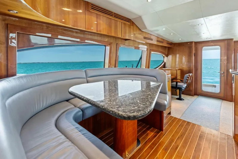Big Game Yacht Photos Pics Luxurious interior of 2006 Hatteras 68 Convertible yacht with ocean view.