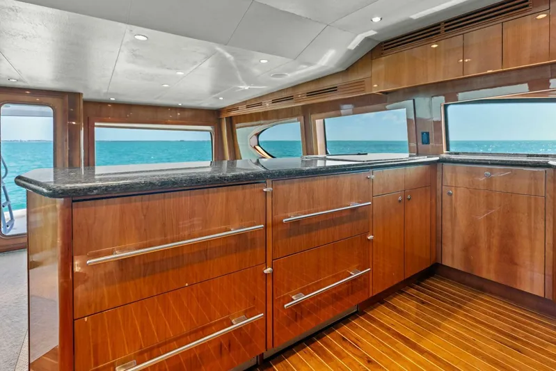Big Game Yacht Photos Pics Luxurious interior of 2006 Hatteras 68 Convertible yacht with ocean view.