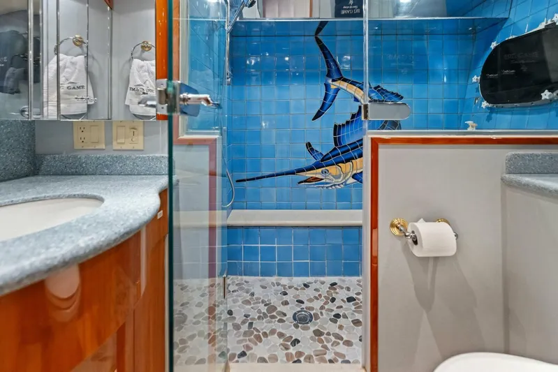 Big Game Yacht Photos Pics Luxurious 2006 Hatteras 68 Convertible yacht bathroom with blue marlin tile design.