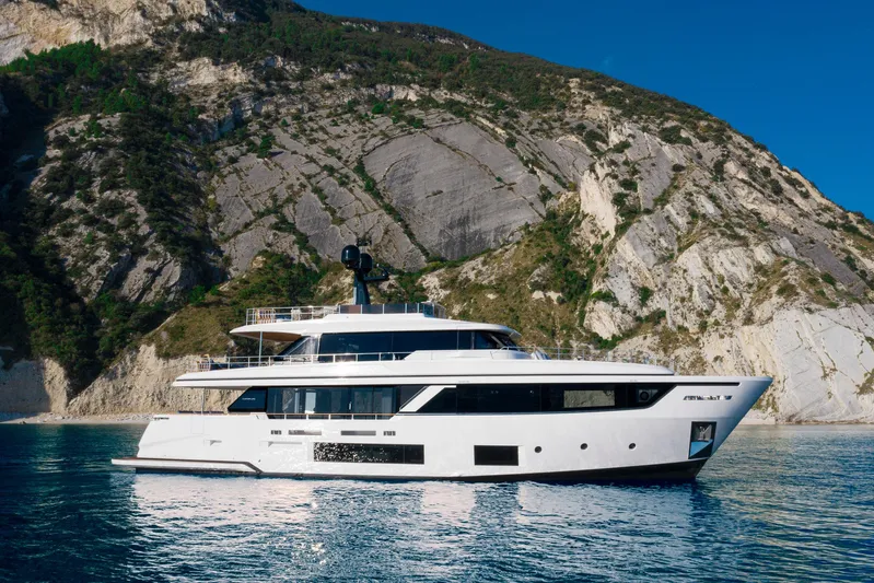  Yacht Photos Pics Luxury yacht Custom Line Navetta 30 near rocky coastline, 2023 model.