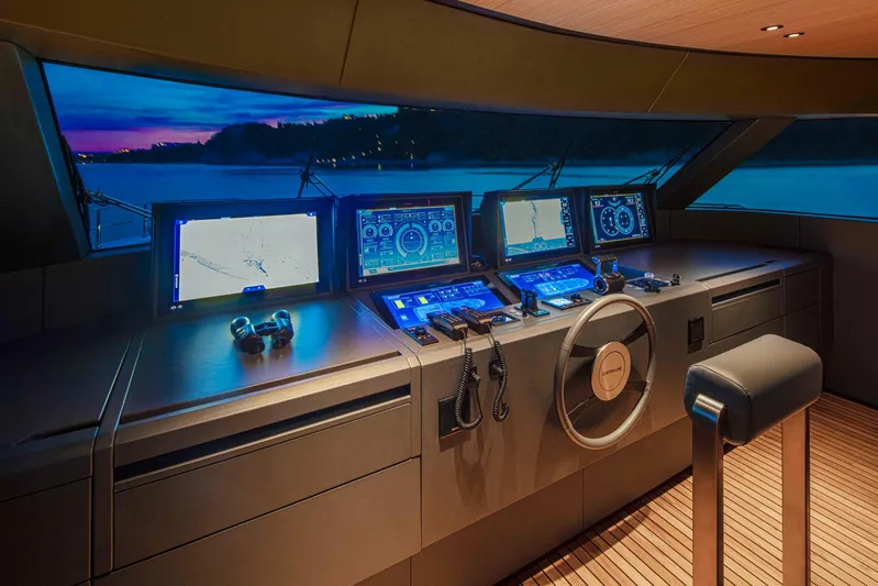  Yacht Photos Pics Helm of Custom Line Navetta 30 yacht, 2023, at sunset.