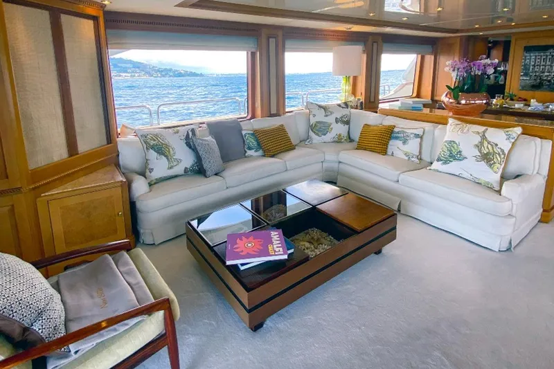 New Star Yacht Photos Pics Luxurious interior of 2002 Benetti Tradition 100 yacht with elegant seating and sea view.