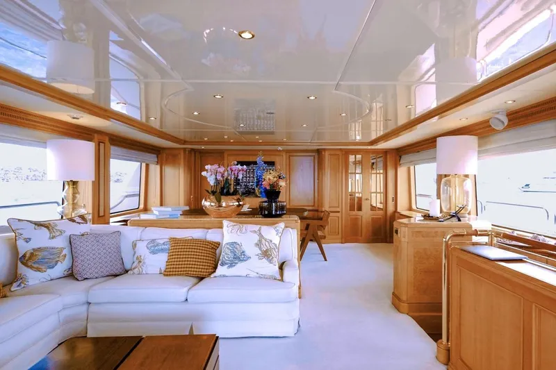 New Star Yacht Photos Pics Luxurious interior of 2002 Benetti Tradition 100 yacht with elegant decor and plush seating.