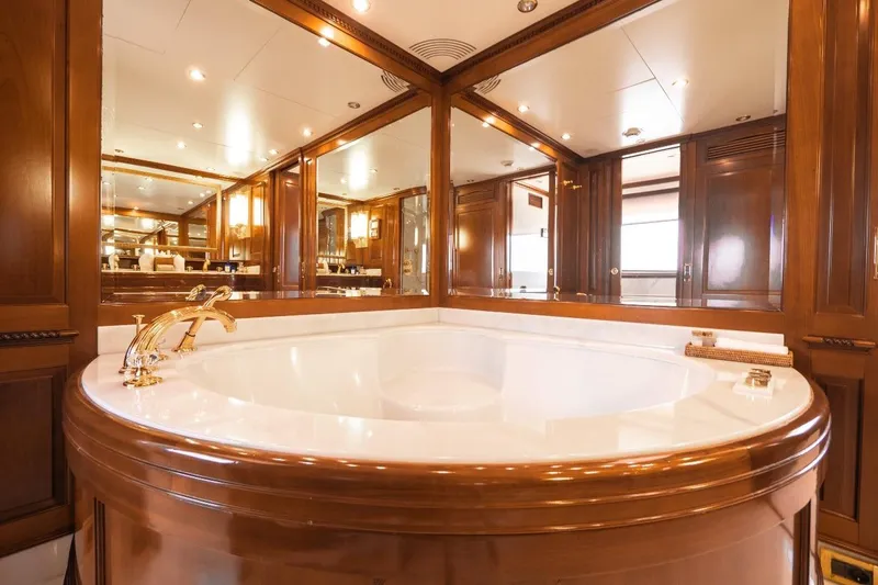 New Star Yacht Photos Pics Luxurious bathroom with wooden accents on a 2002 Benetti Tradition 100 yacht.