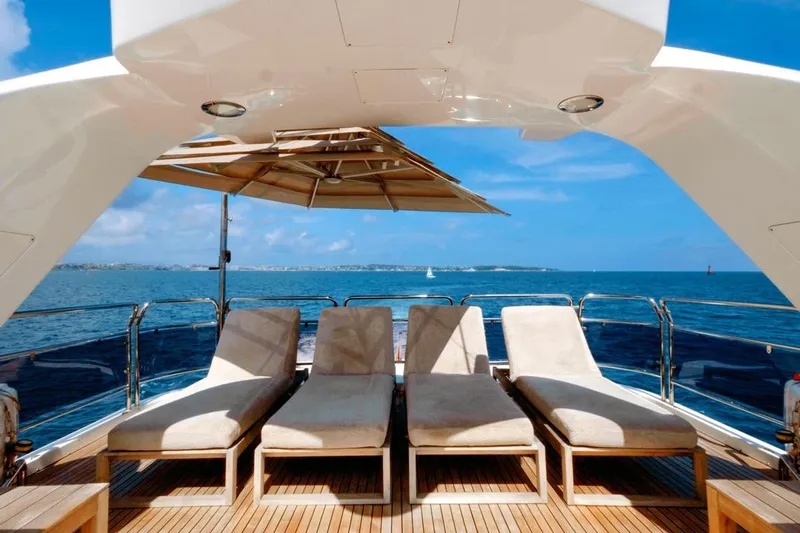 New Star Yacht Photos Pics Luxurious Benetti Tradition 100 yacht deck with sun loungers, ocean view, 2002 model.